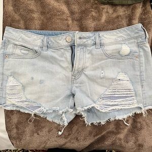 Express women’s distressed denim shorts with stripe pocket detail